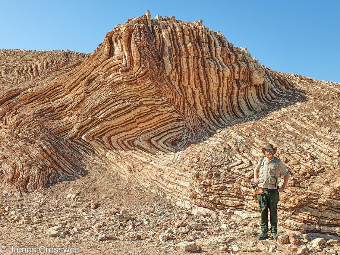 A photograph of James Cresswell, director of GeoWorld Travel, at the Mother of all Outcrops in Oman